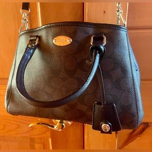 Brown Coach tote with adjustable cross body strap